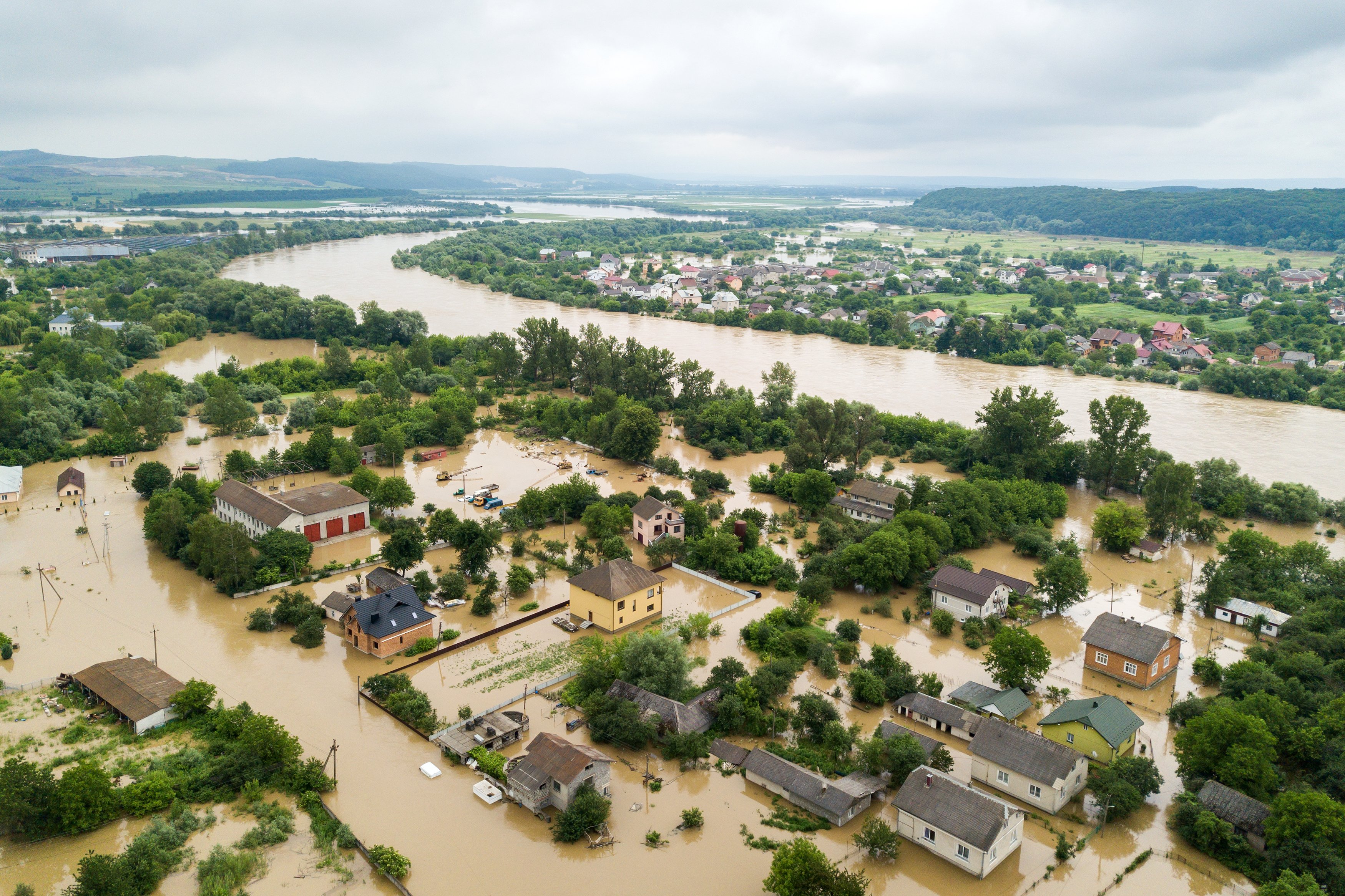 aerial-view-of-flooded-houses-with-dirty-water-of-dnister-river-in-halych-town-western-ukraine